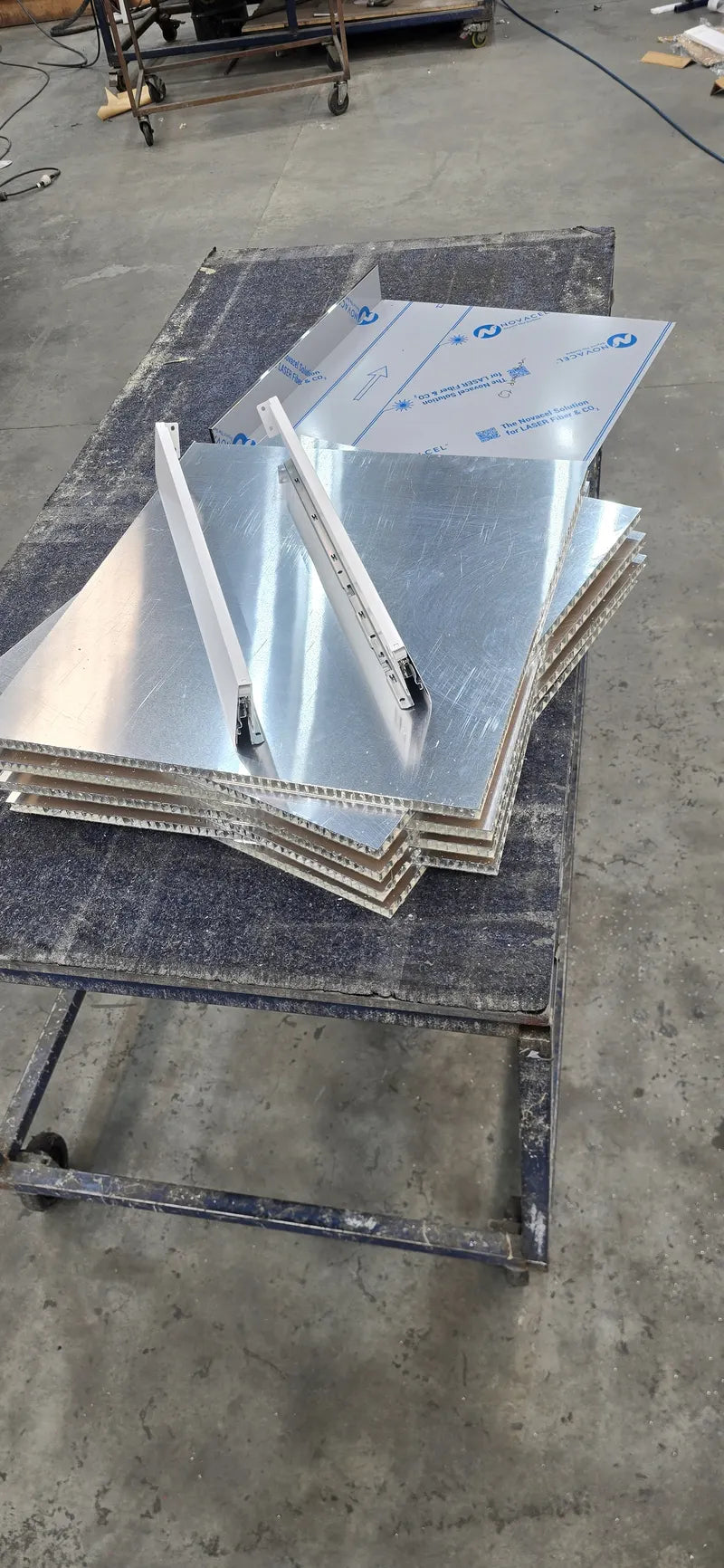 Folded stainless steel drawer fronts for an outdoor kitchen